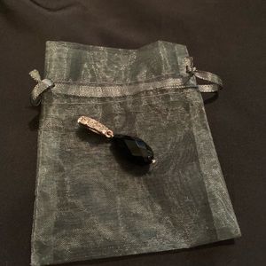 Black stone pendant in gold setting